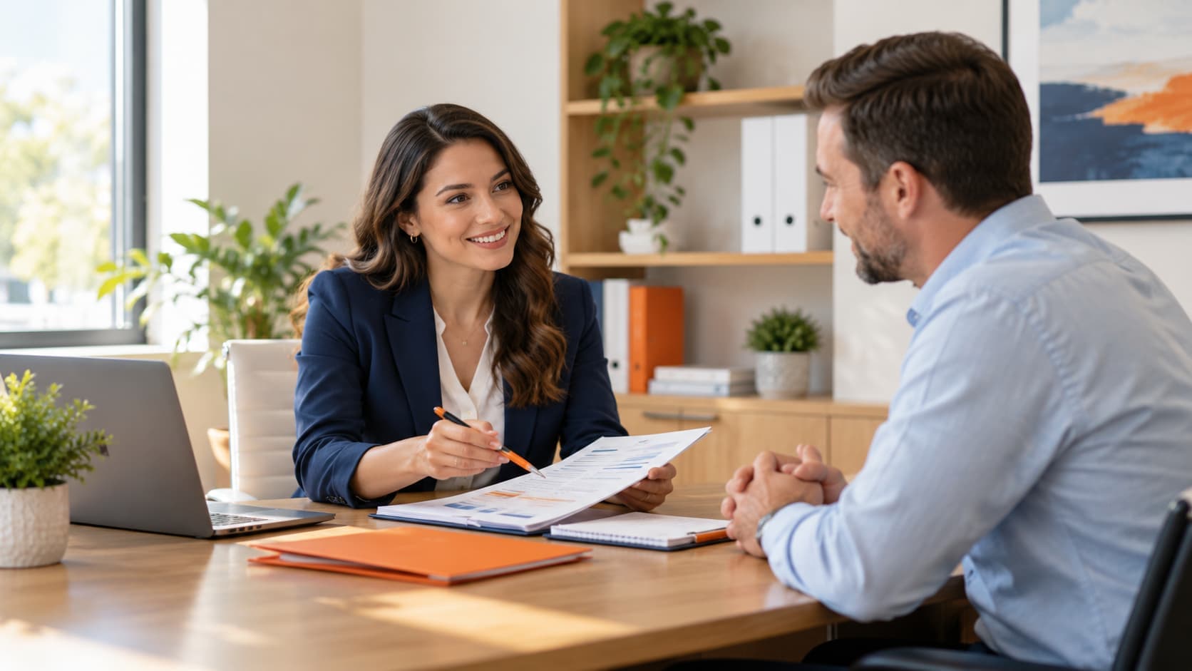 Insurance agent reviewing affordable car insurance options with a customer at an Oklahoma City insurance office.